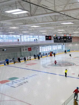 Aerial image showing dozens of skaters on one of the twin pads at the MIskin Law Community Complex.